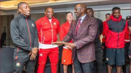 President William Ruto sharing a moment with Harambee Stars players.
